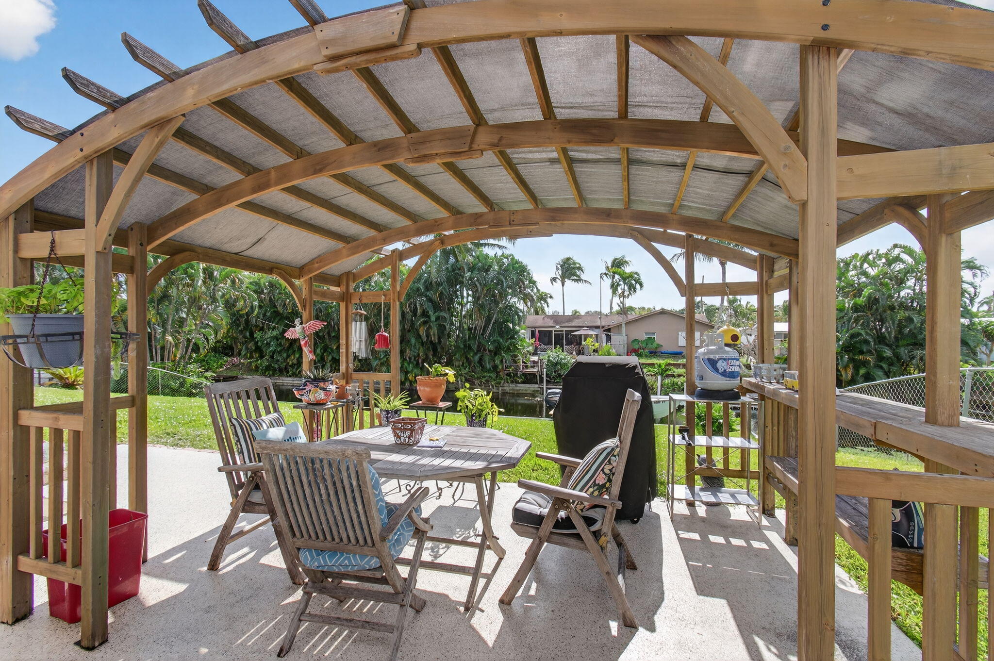 1060 Old Boynton Road Boynton Beach, FL 33426 - Photo 34 of 47 a view of a chairs and table in patio