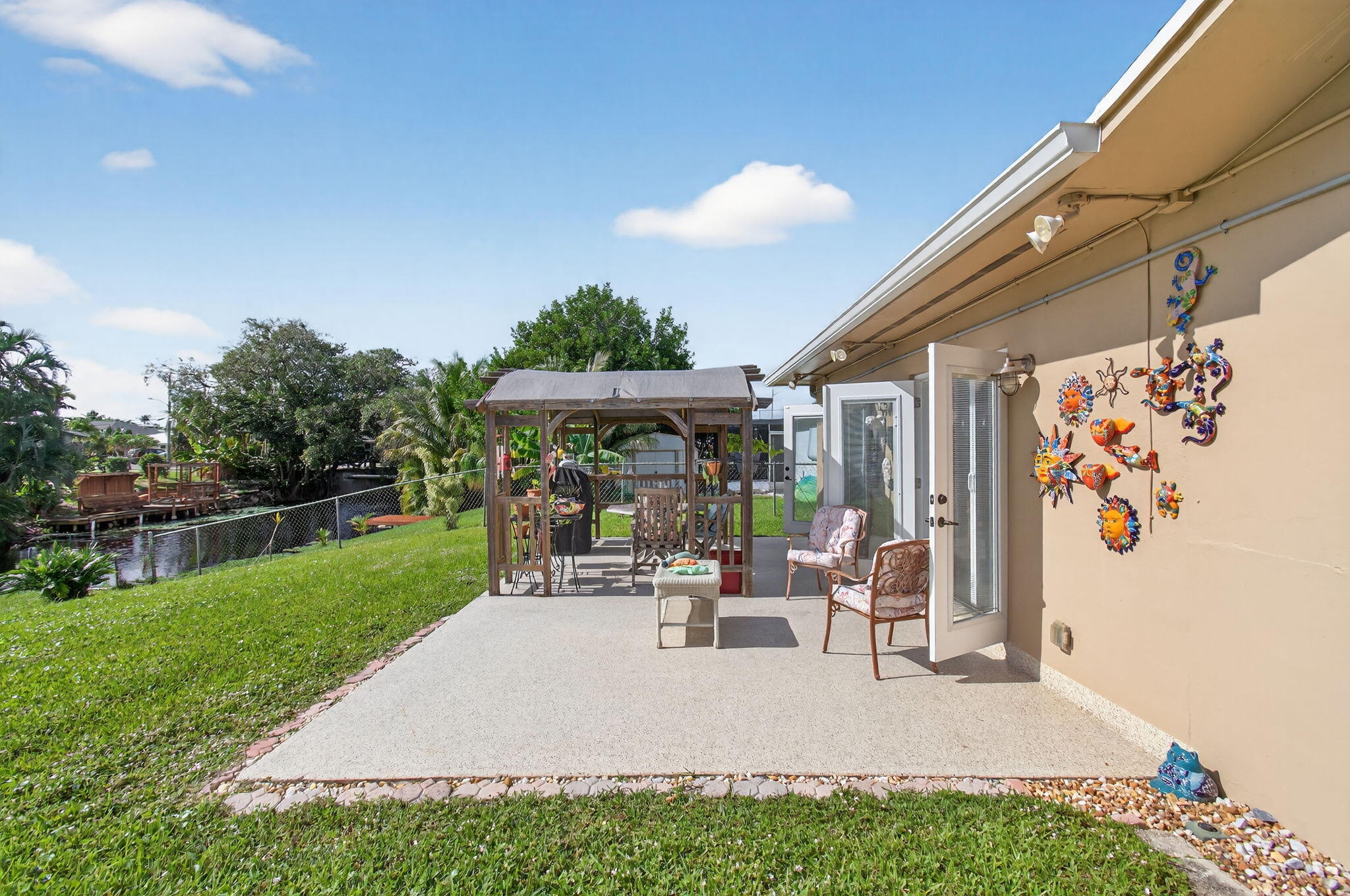 1060 Old Boynton Road Boynton Beach, FL 33426 - Photo 36 of 47 a view of a backyard with sitting area