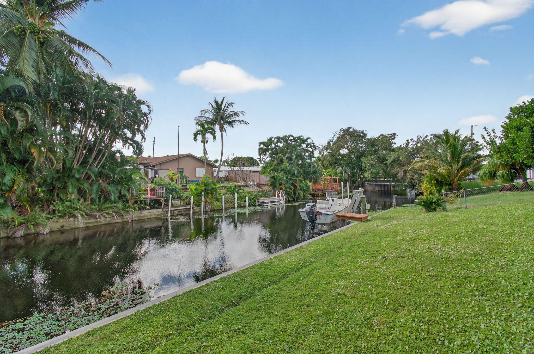 1060 Old Boynton Road Boynton Beach, FL 33426 - Photo 39 of 47 a view of a lake with a house in the background