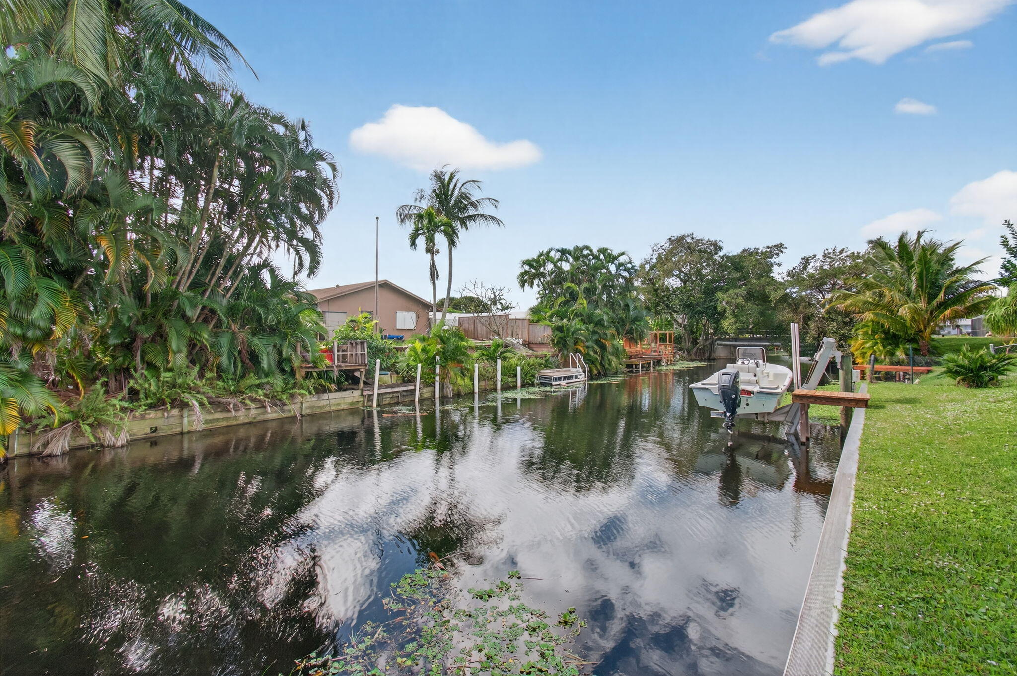 1060 Old Boynton Road Boynton Beach, FL 33426 - Photo 4 of 47 a view of a lake with a yard and outdoor seating