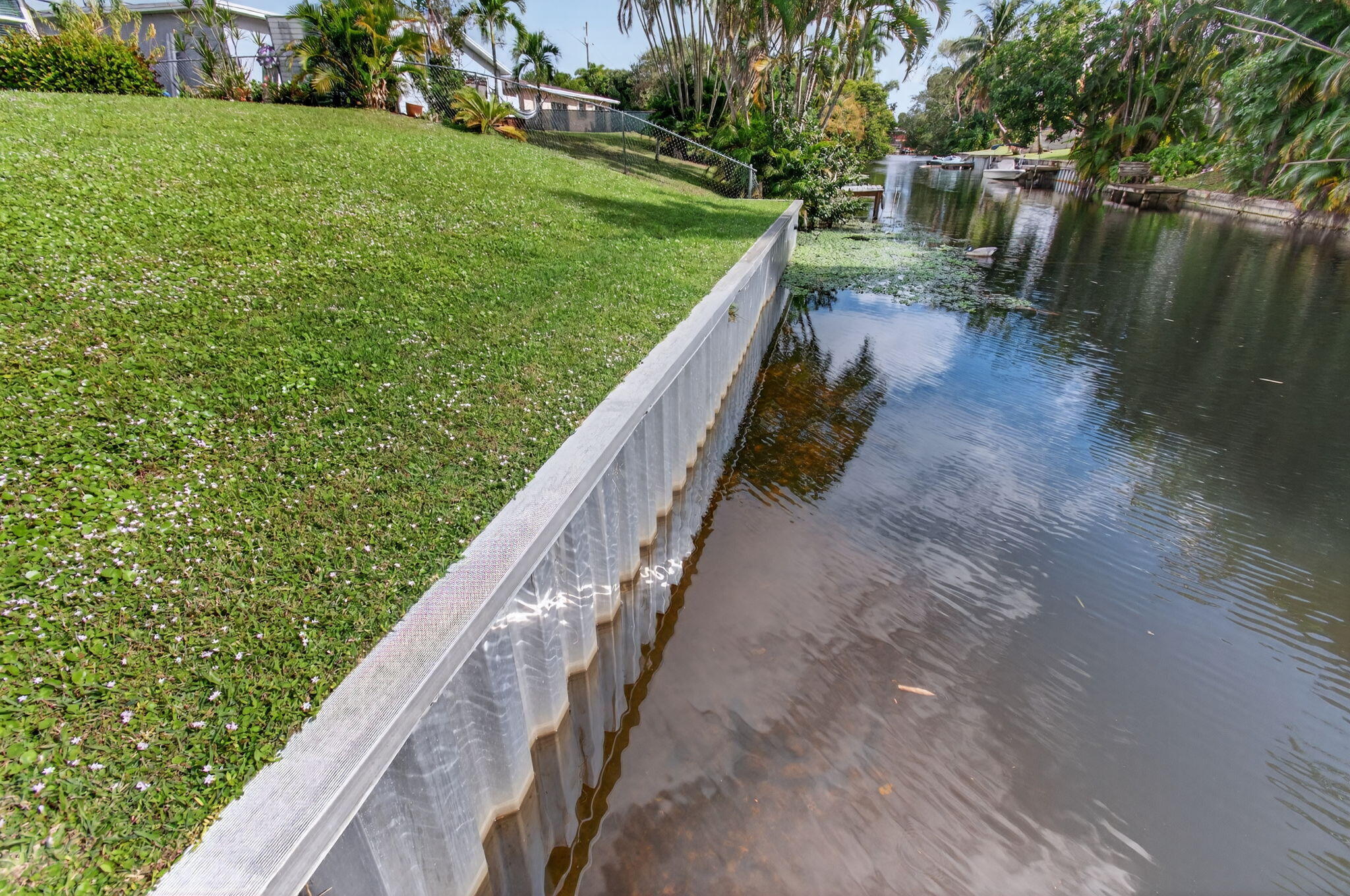 1060 Old Boynton Road Boynton Beach, FL 33426 - Photo 42 of 47 a view of a yard with plants and a lake view