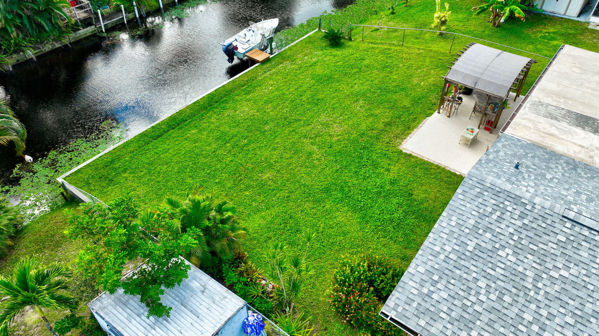 1060 Old Boynton Road Boynton Beach, FL 33426 - Photo 43 of 47 an aerial view of a house with a yard and lake view