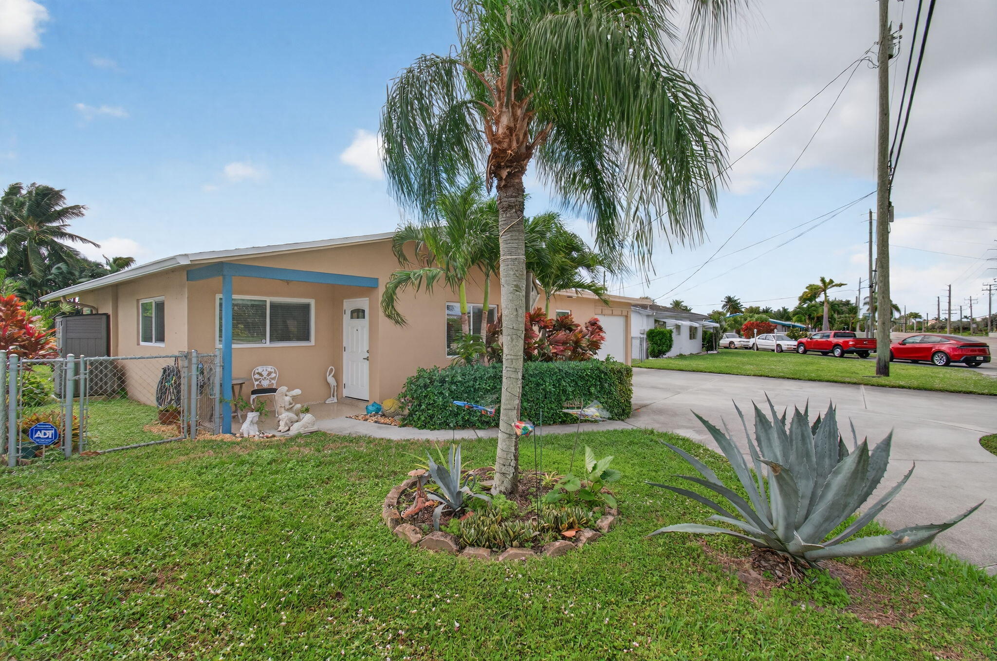 1060 Old Boynton Road Boynton Beach, FL 33426 - Photo 5 of 47 a front view of a house with garden and trees