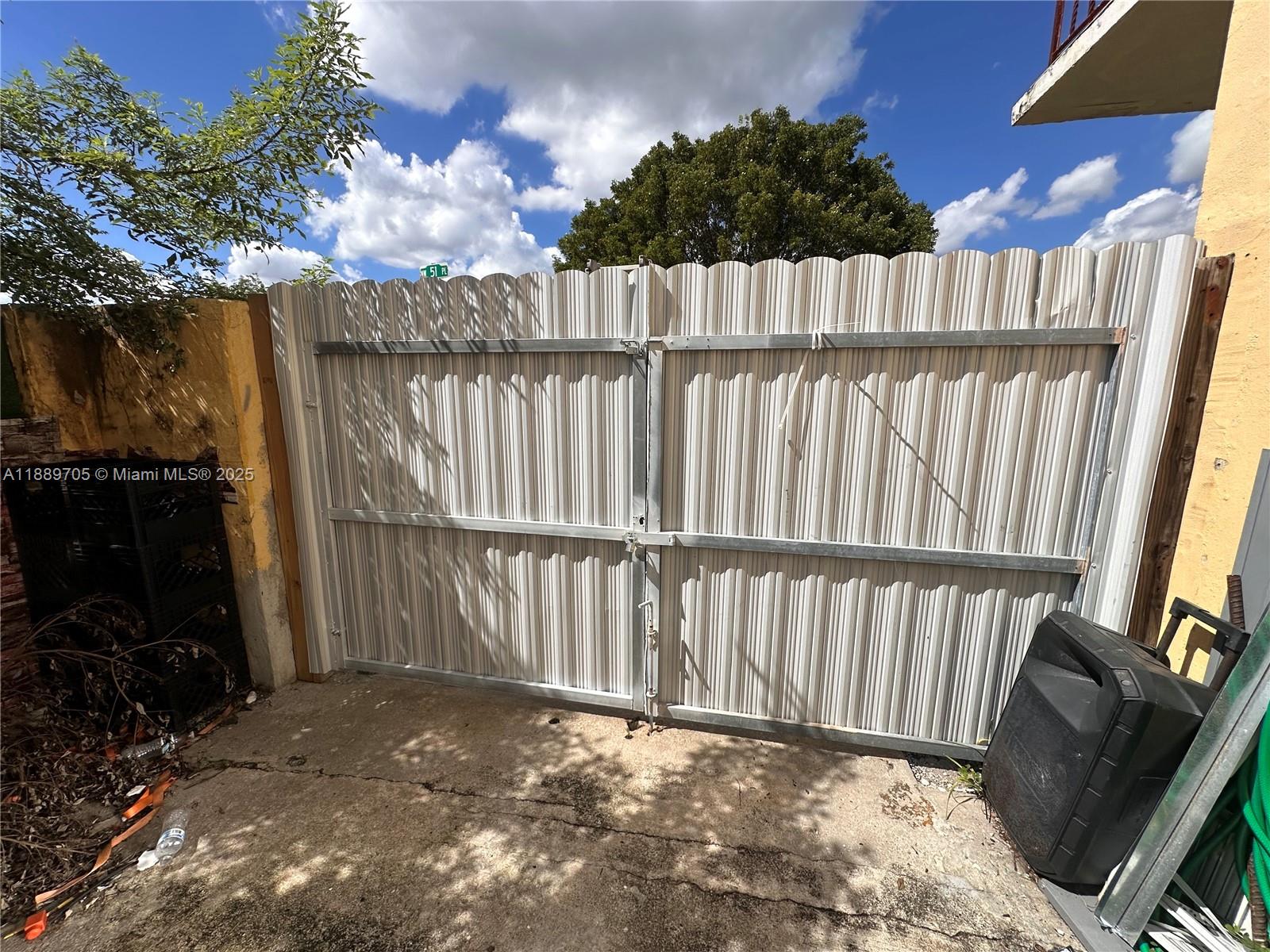 16901 Northwest 51st Place, Unit C Miami Gardens, FL 33055 - Photo 12 of 13 a view of a wooden fence