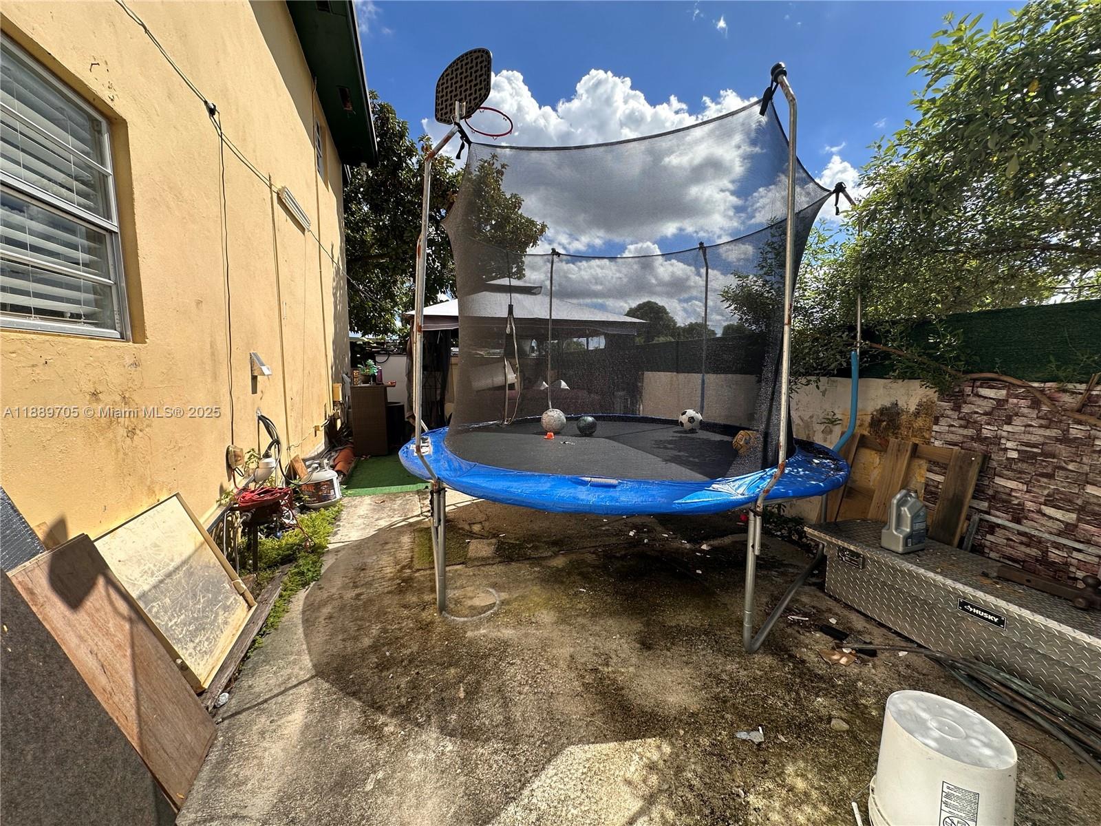 16901 Northwest 51st Place, Unit C Miami Gardens, FL 33055 - Photo 13 of 13 a living room with patio furniture