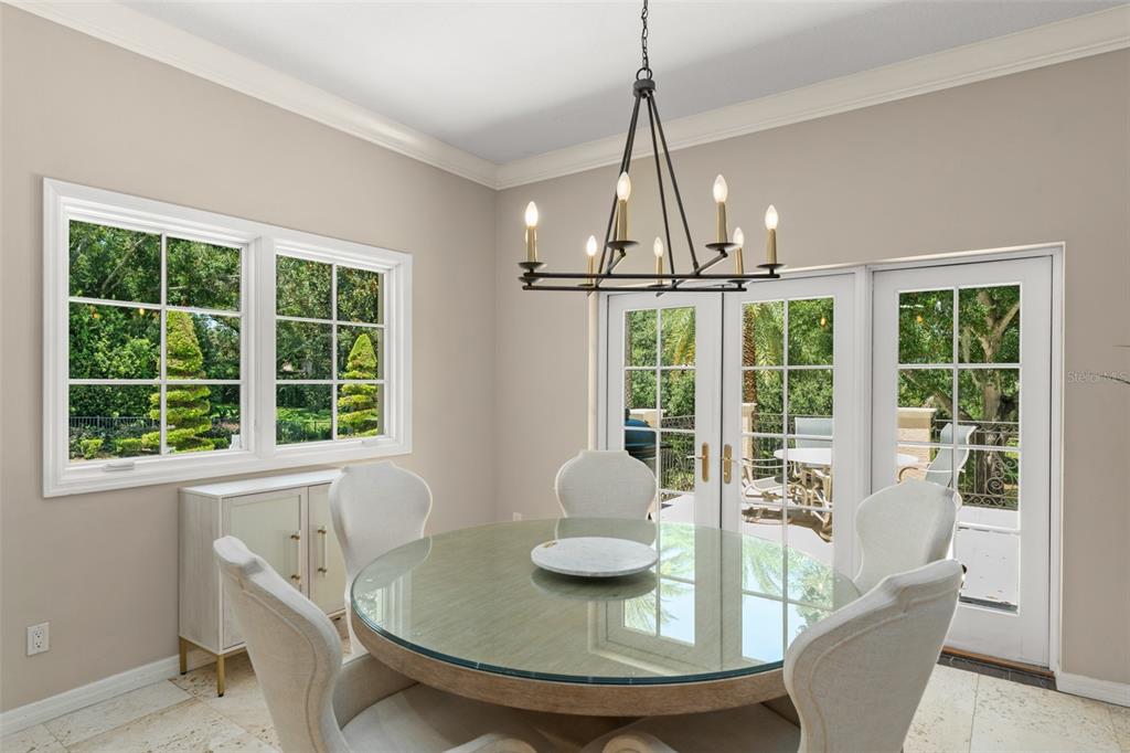 9731 Chestnut Ridge Drive Windermere, FL 34786 - Photo 17 of 57 a view of a dining room with furniture window and outside view