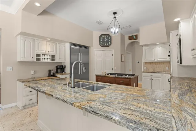 a bedroom with a bed and a flat screen television