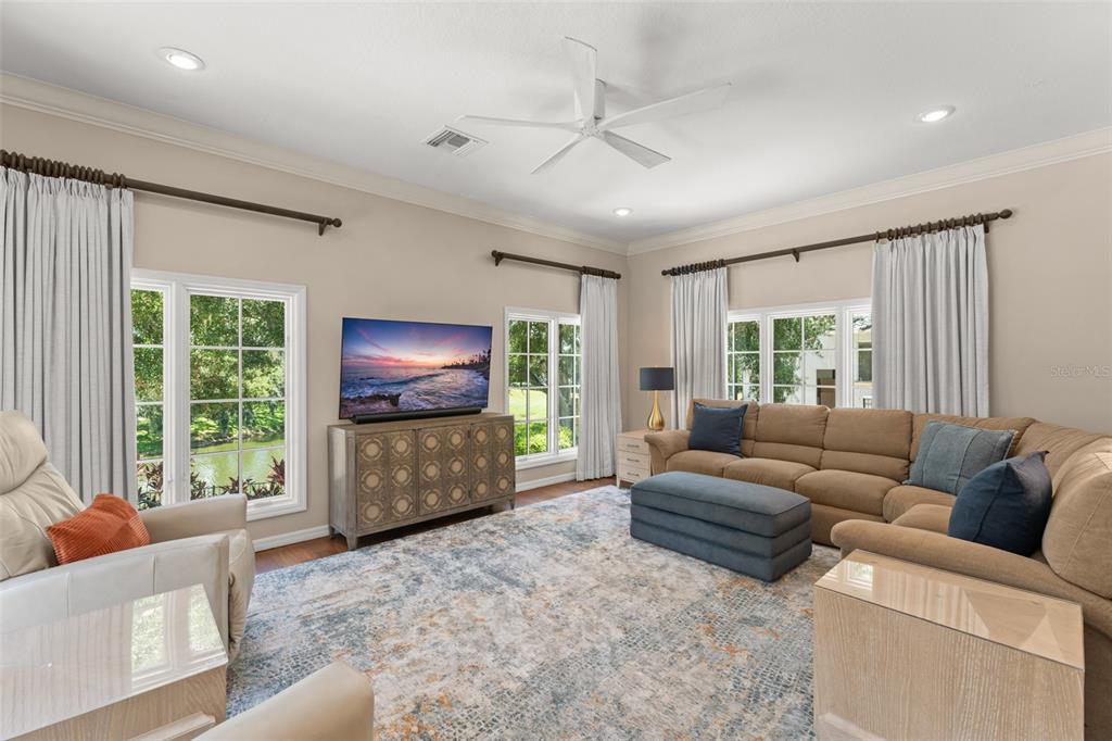 9731 Chestnut Ridge Drive Windermere, FL 34786 - Photo 22 of 57 a living room with furniture and a flat screen tv