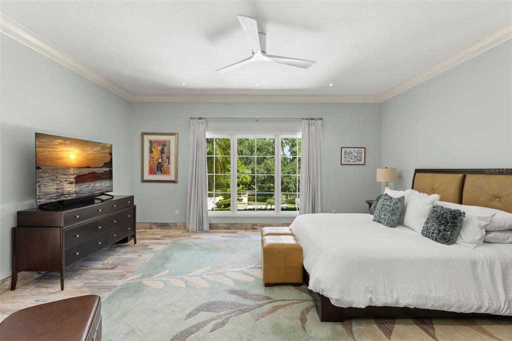 9731 Chestnut Ridge Drive Windermere, FL 34786 - Photo 23 of 57 a bedroom with a bed and a flat screen television