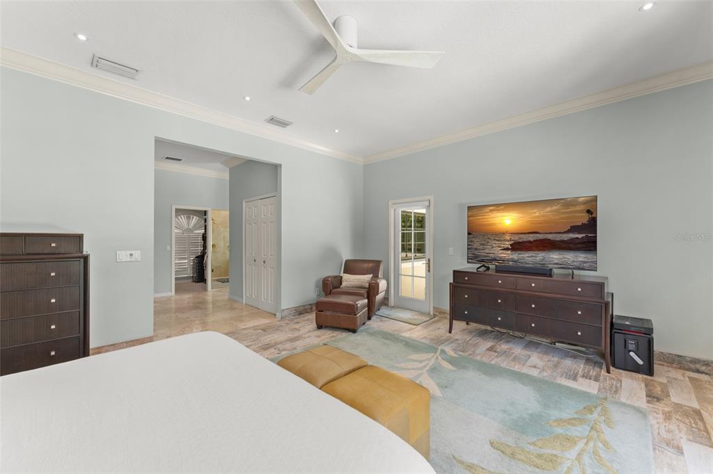 9731 Chestnut Ridge Drive Windermere, FL 34786 - Photo 25 of 57 a bedroom with a bed and a flat screen tv