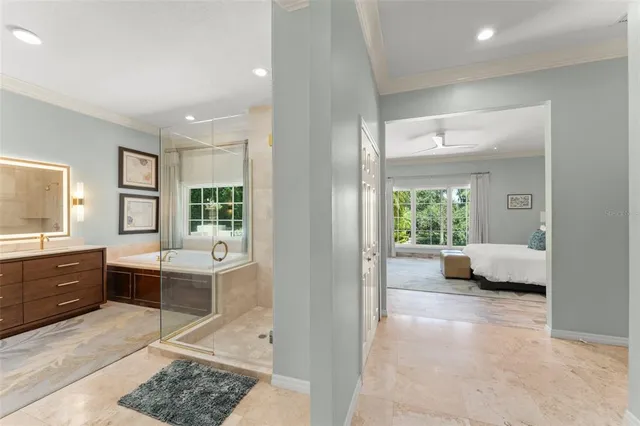 a living room with furniture a window and bookshelf