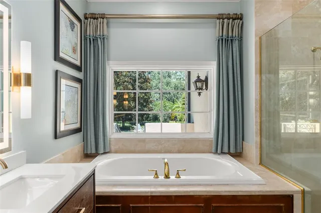 a bedroom with a large bed and a large window