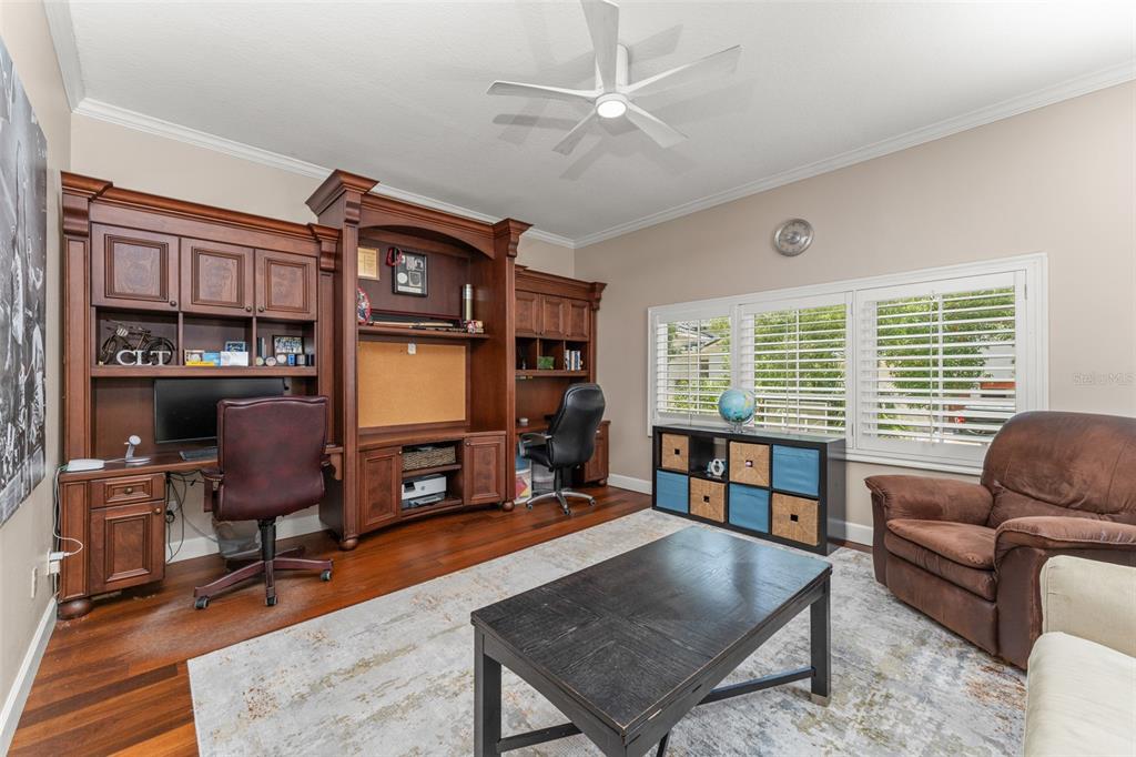 9731 Chestnut Ridge Drive Windermere, FL 34786 - Photo 30 of 57 a living room with furniture a window and bookshelf