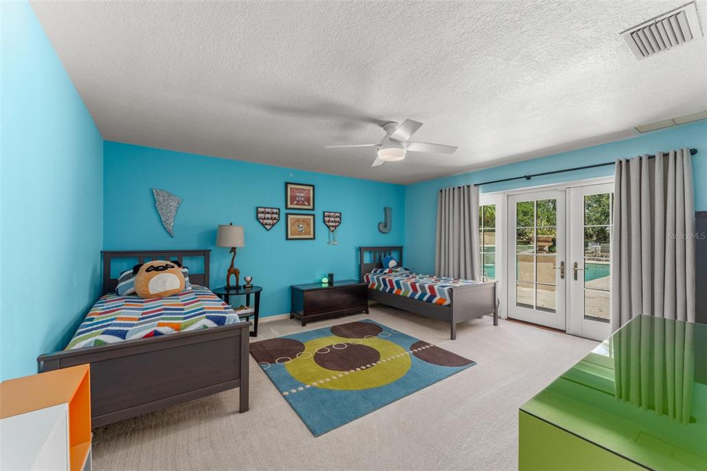 9731 Chestnut Ridge Drive Windermere, FL 34786 - Photo 39 of 57 a bedroom with furniture and a window