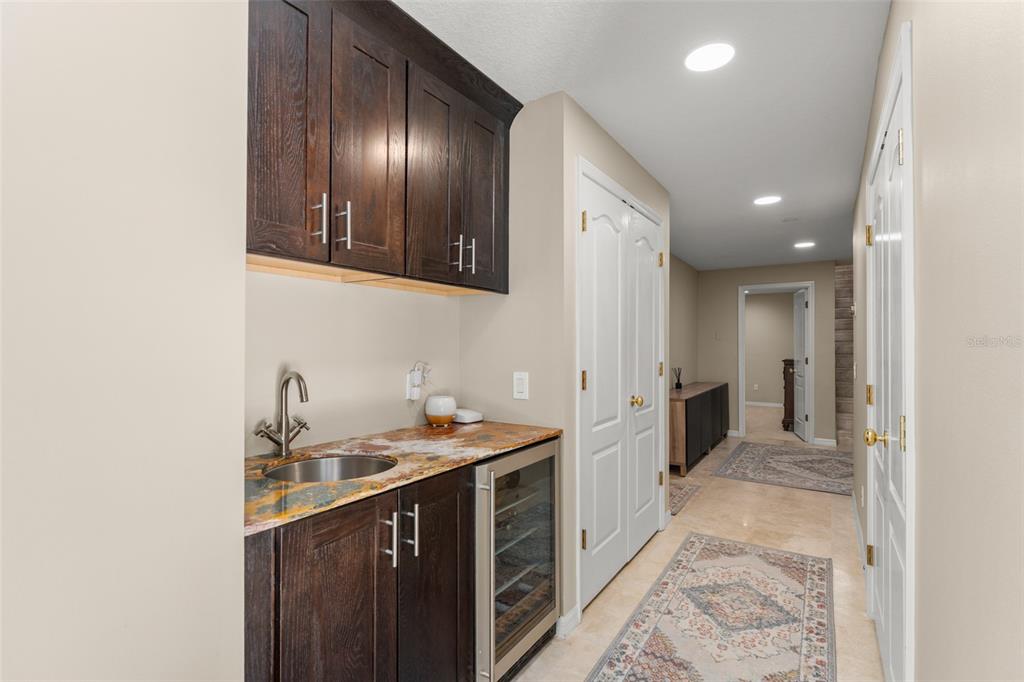 9731 Chestnut Ridge Drive Windermere, FL 34786 - Photo 45 of 57 a kitchen with a sink and cabinets