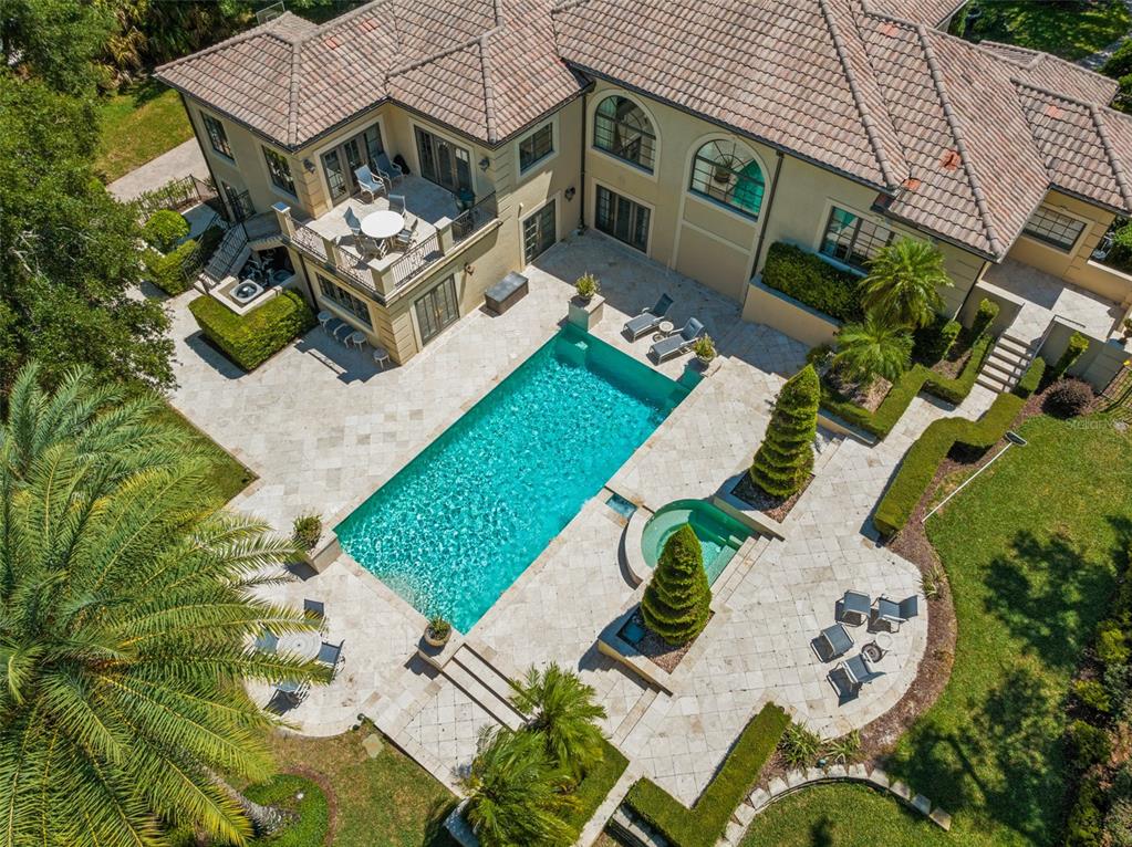 9731 Chestnut Ridge Drive Windermere, FL 34786 - Photo 46 of 57 an aerial view of a house with a garden