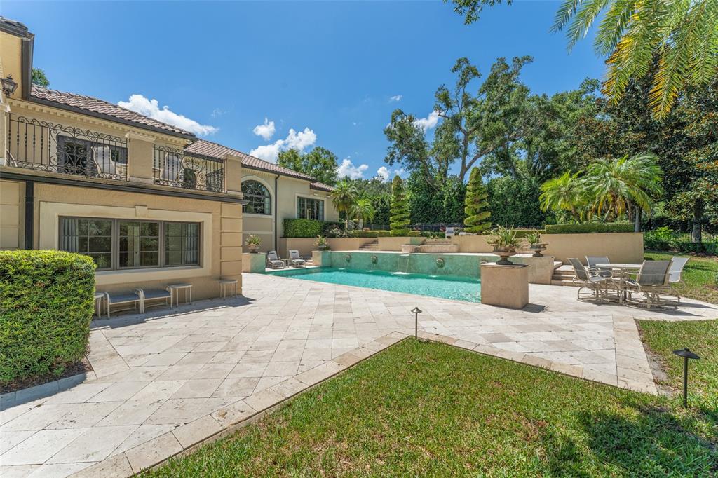 9731 Chestnut Ridge Drive Windermere, FL 34786 - Photo 50 of 57 a view of a house with backyard and sitting area