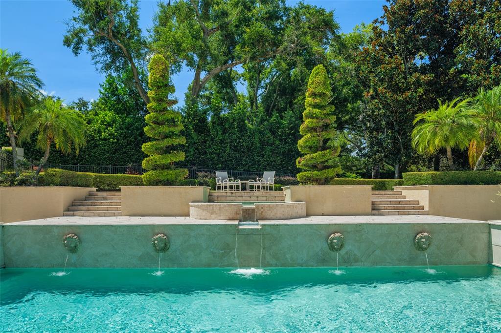 9731 Chestnut Ridge Drive Windermere, FL 34786 - Photo 53 of 57 a view of a garden with large trees