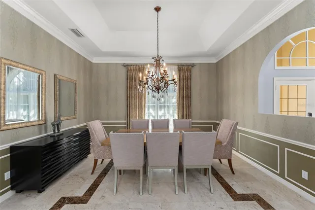 a kitchen with stainless steel appliances granite countertop a stove refrigerator and cabinets