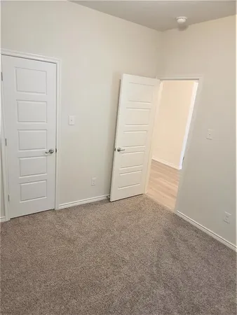 an empty room with a hallway