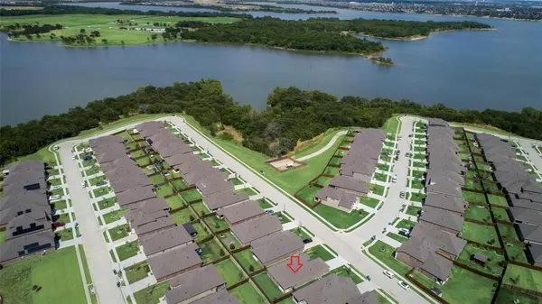 an aerial view of a house with a lake view