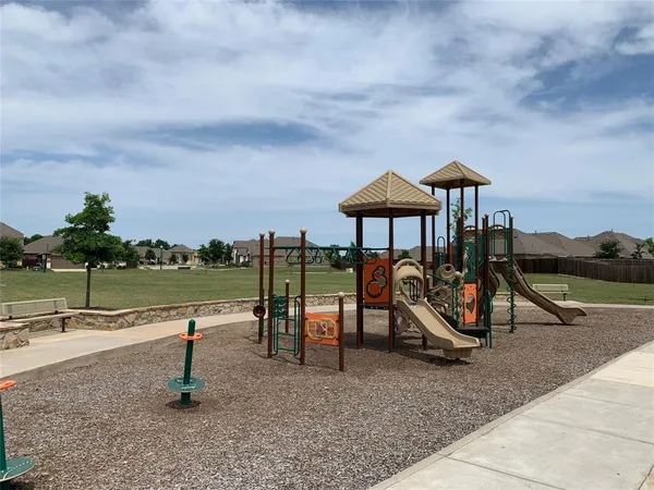 a view of a park with swings