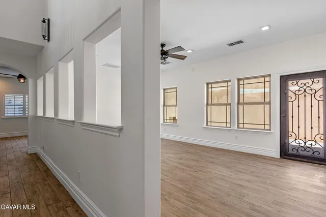 a view of an empty room with a window