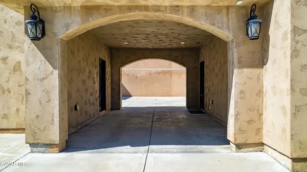 a view of a hallway with wooden floor and entryway