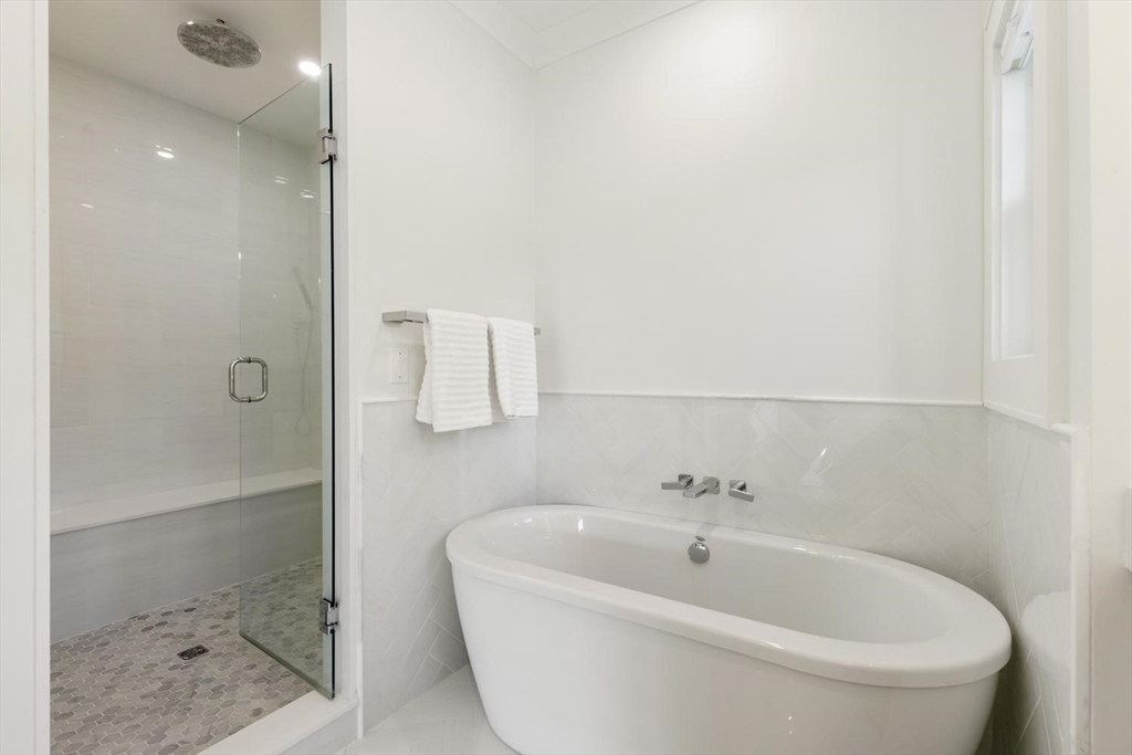 1124 Chestnut Street Newton, MA 02464 - Photo 20 of 41 a white bath tub sitting next to a shower