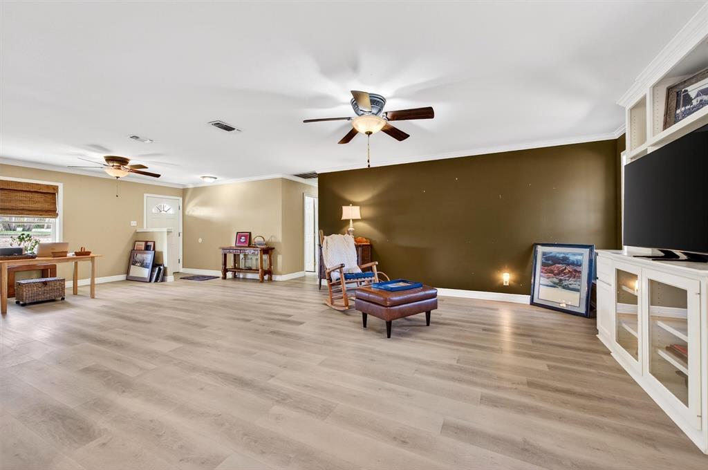 140 Harrell Road Howe, TX 75459 - Photo 11 of 40 a living room with furniture and a flat screen tv