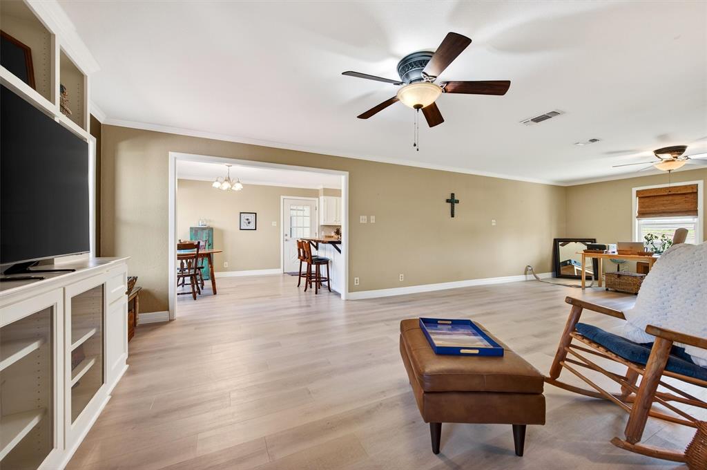 140 Harrell Road Howe, TX 75459 - Photo 12 of 40 a living room with furniture and a flat screen tv