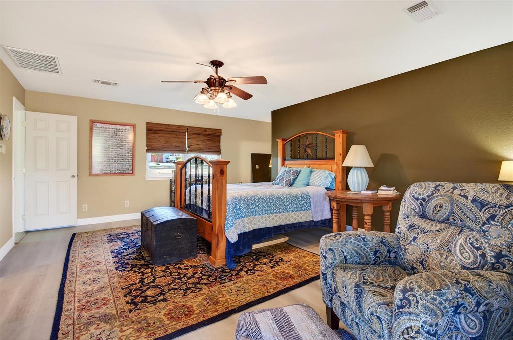 140 Harrell Road Howe, TX 75459 - Photo 22 of 40 a bedroom with furniture and wooden floor