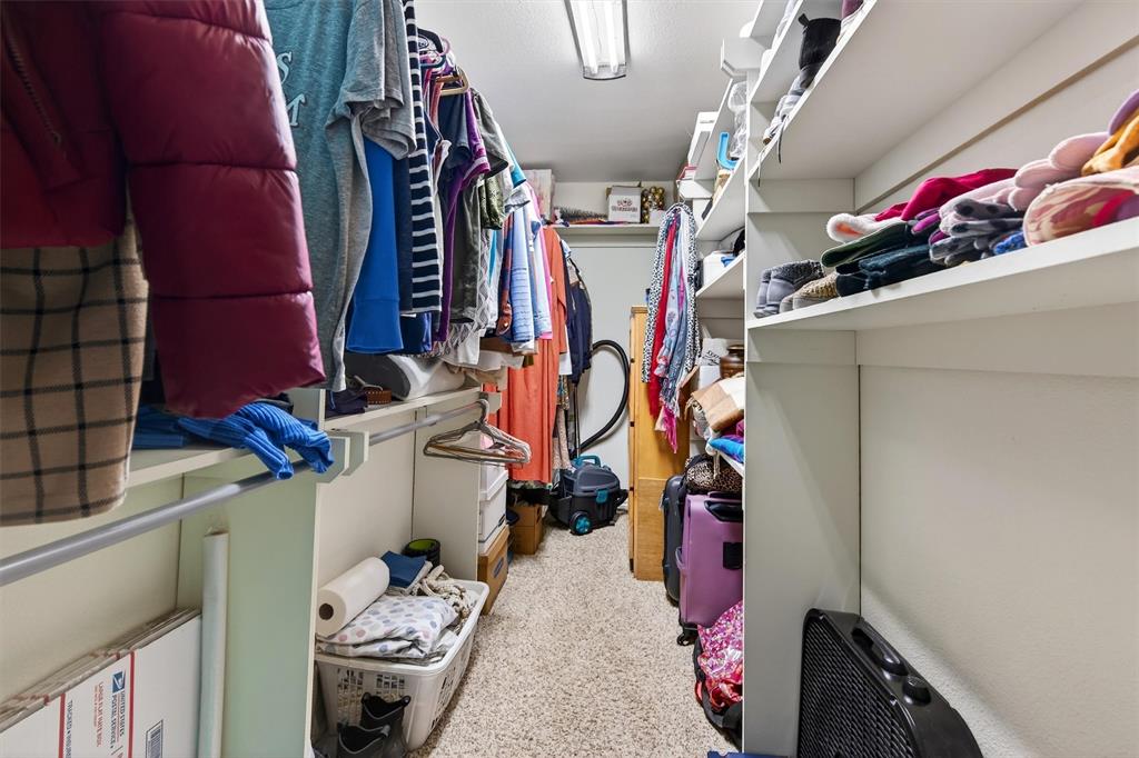 140 Harrell Road Howe, TX 75459 - Photo 24 of 40 a view of walk in closet with clothes and shoes