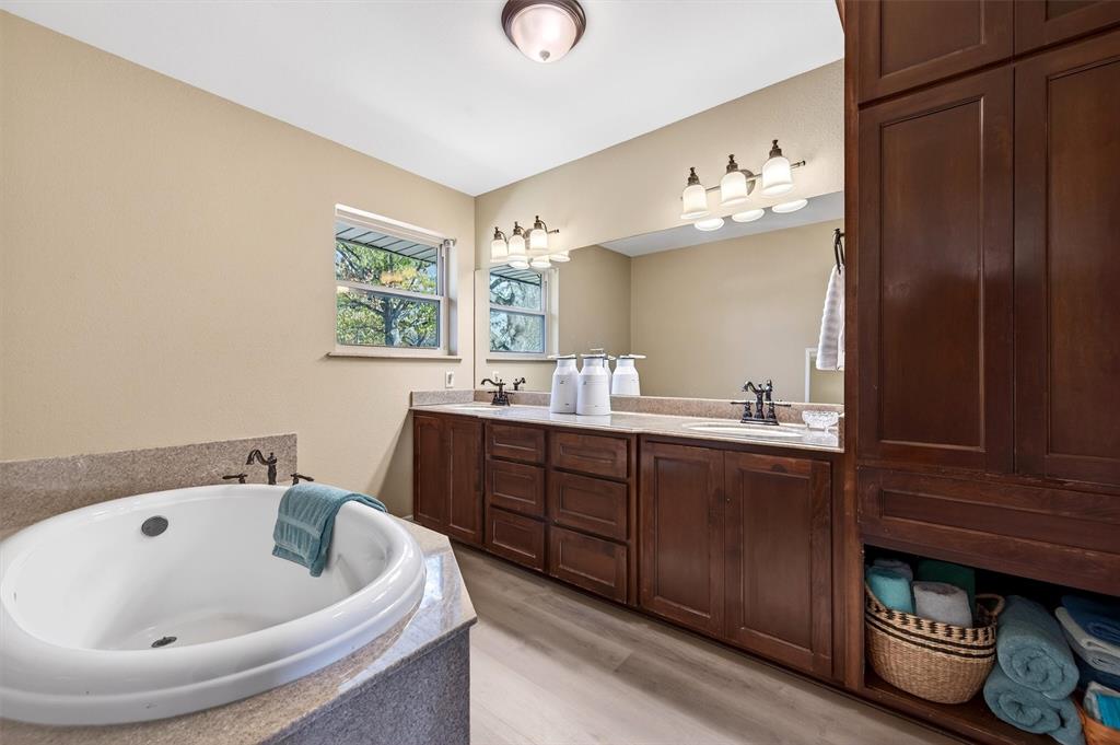 140 Harrell Road Howe, TX 75459 - Photo 26 of 40 a bathroom with a tub sink and mirror