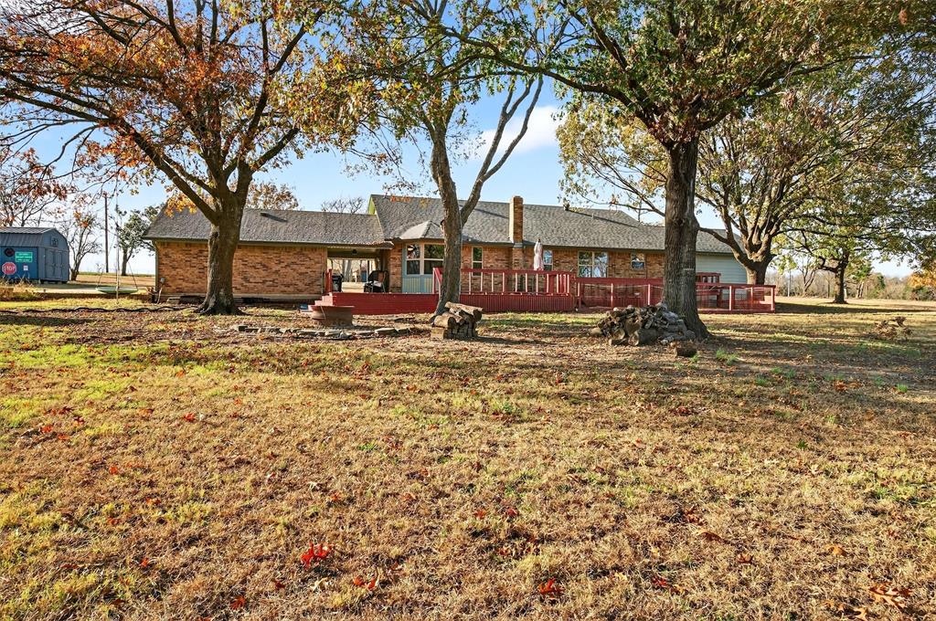 140 Harrell Road Howe, TX 75459 - Photo 33 of 40 a backyard of a house with lots of green space