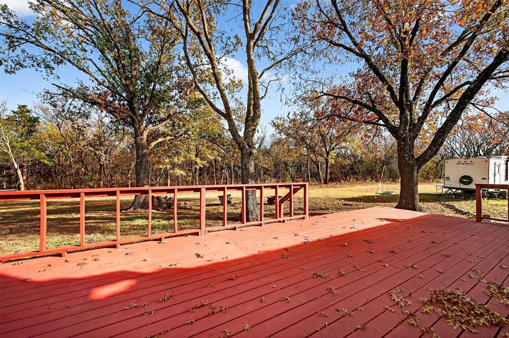 140 Harrell Road Howe, TX 75459 - Photo 37 of 40 a view of outdoor space with wooden deck and trees