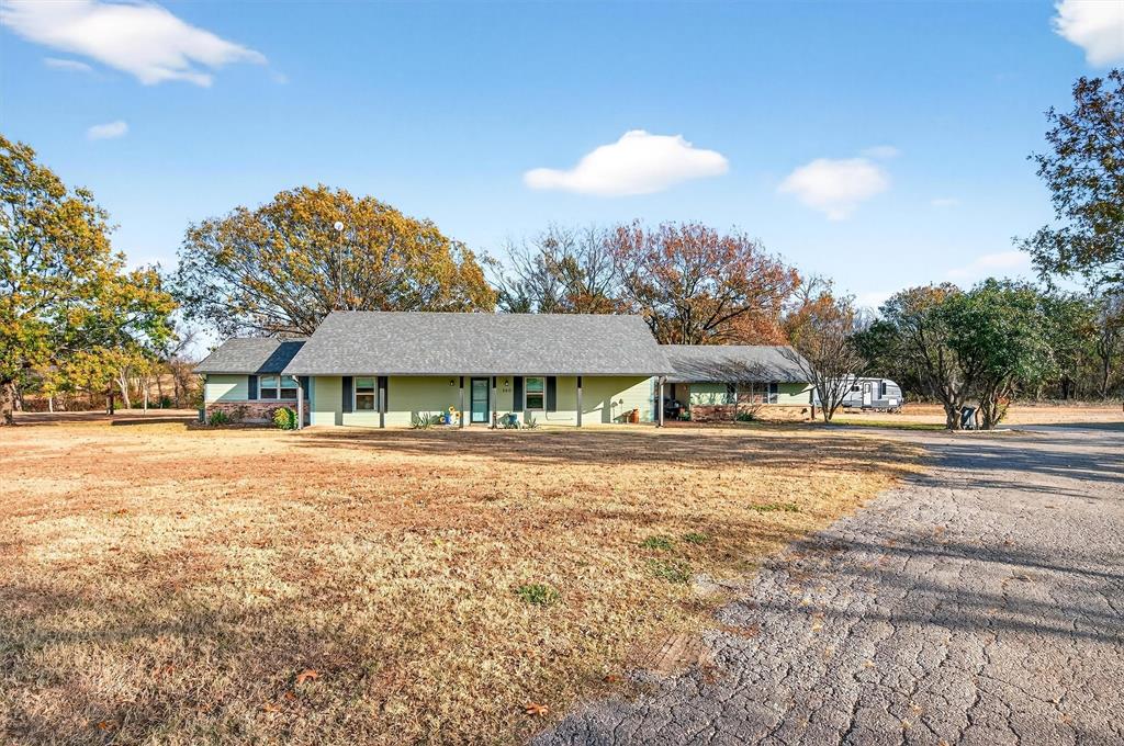 140 Harrell Road Howe, TX 75459 - Photo 4 of 40 a view of a large house with a big yard and large trees