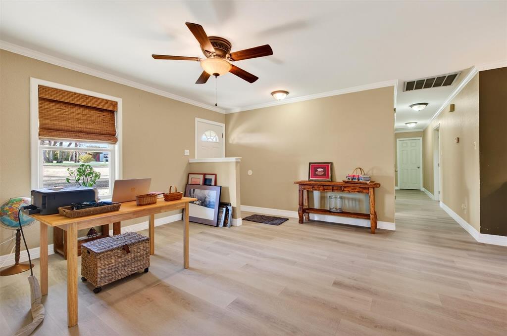 140 Harrell Road Howe, TX 75459 - Photo 9 of 40 a living room with furniture and a gym equipment