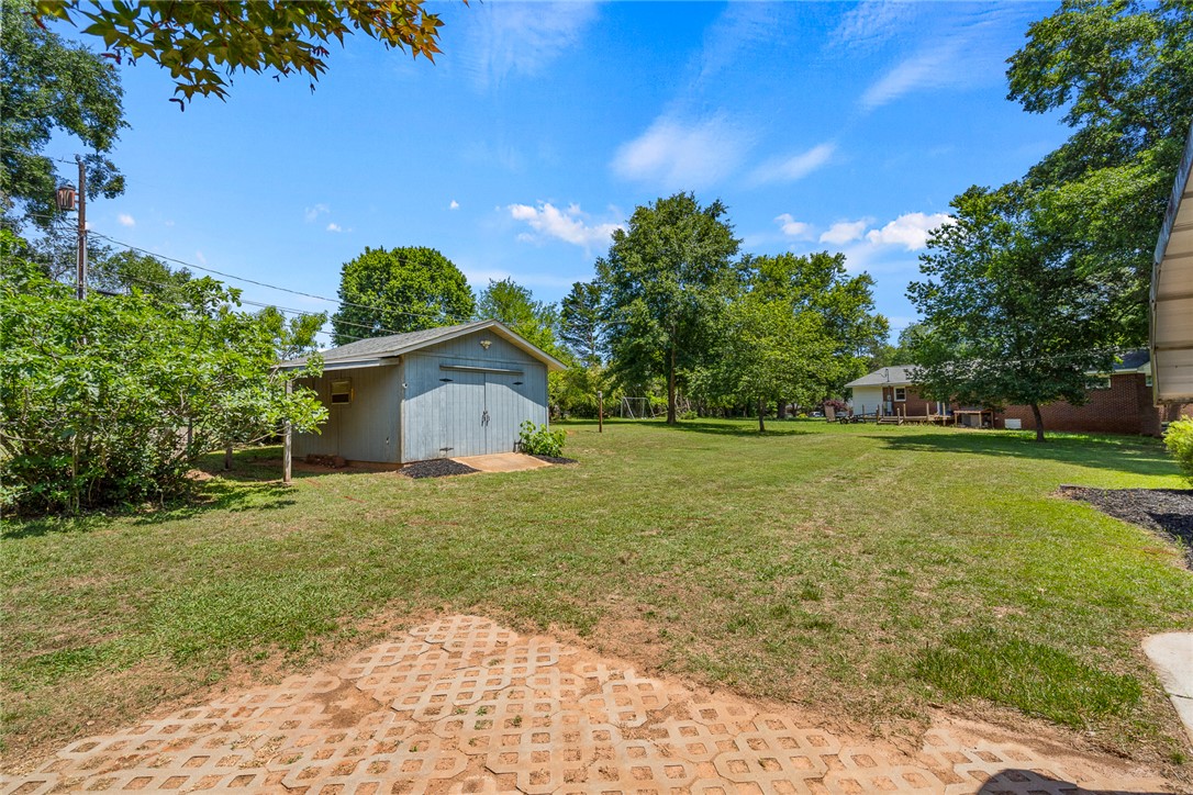 1509 869 Anderson, SC 29621 - Photo 41 of 45 A detached shed offers versatile storage in the spacious, well-maintained yard.