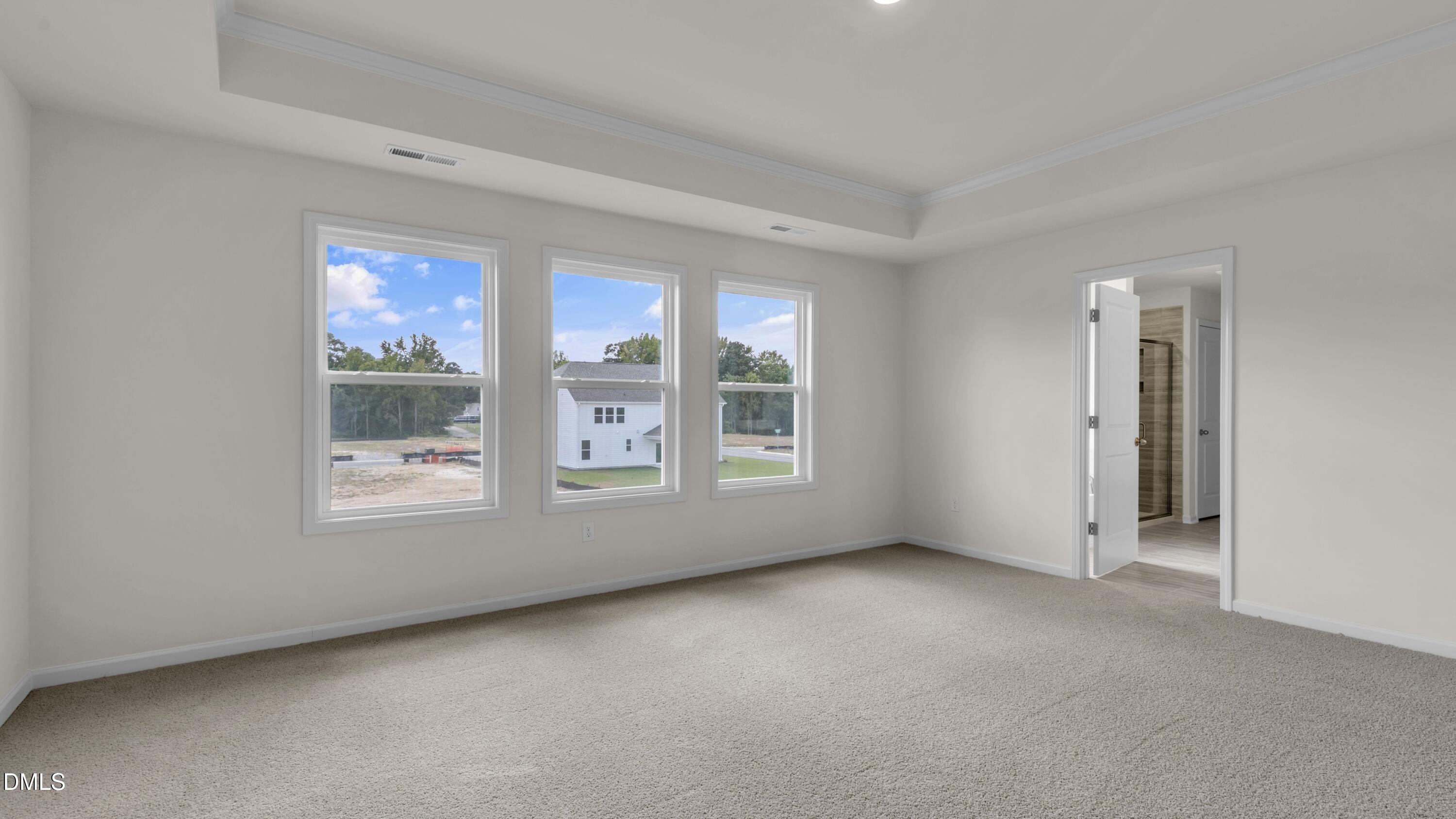 191 Gilmer Street Fuquay-Varina, NC 27526 - Photo 19 of 40 an empty room with windows