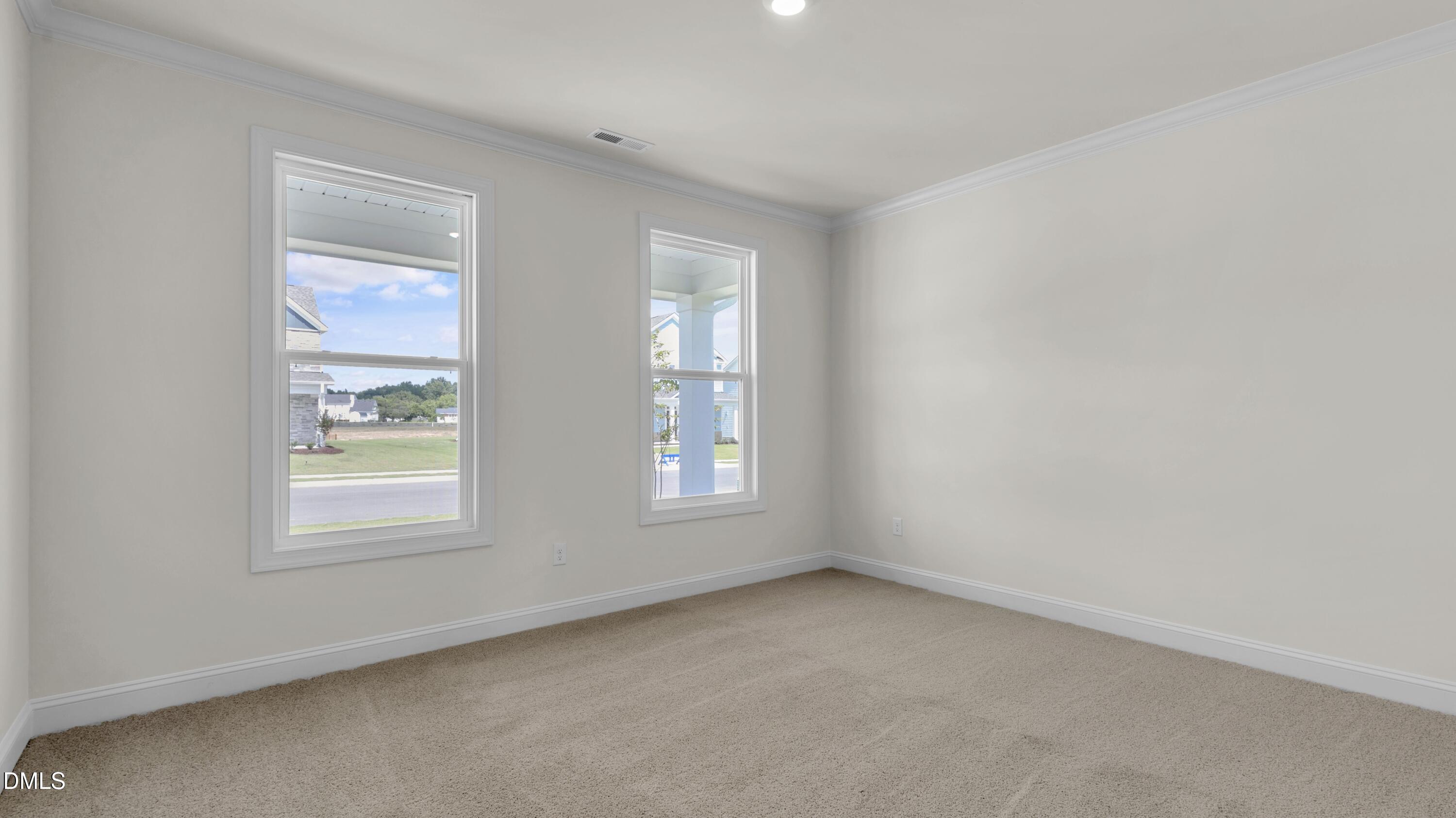 191 Gilmer Street Fuquay-Varina, NC 27526 - Photo 22 of 40 an empty room with windows