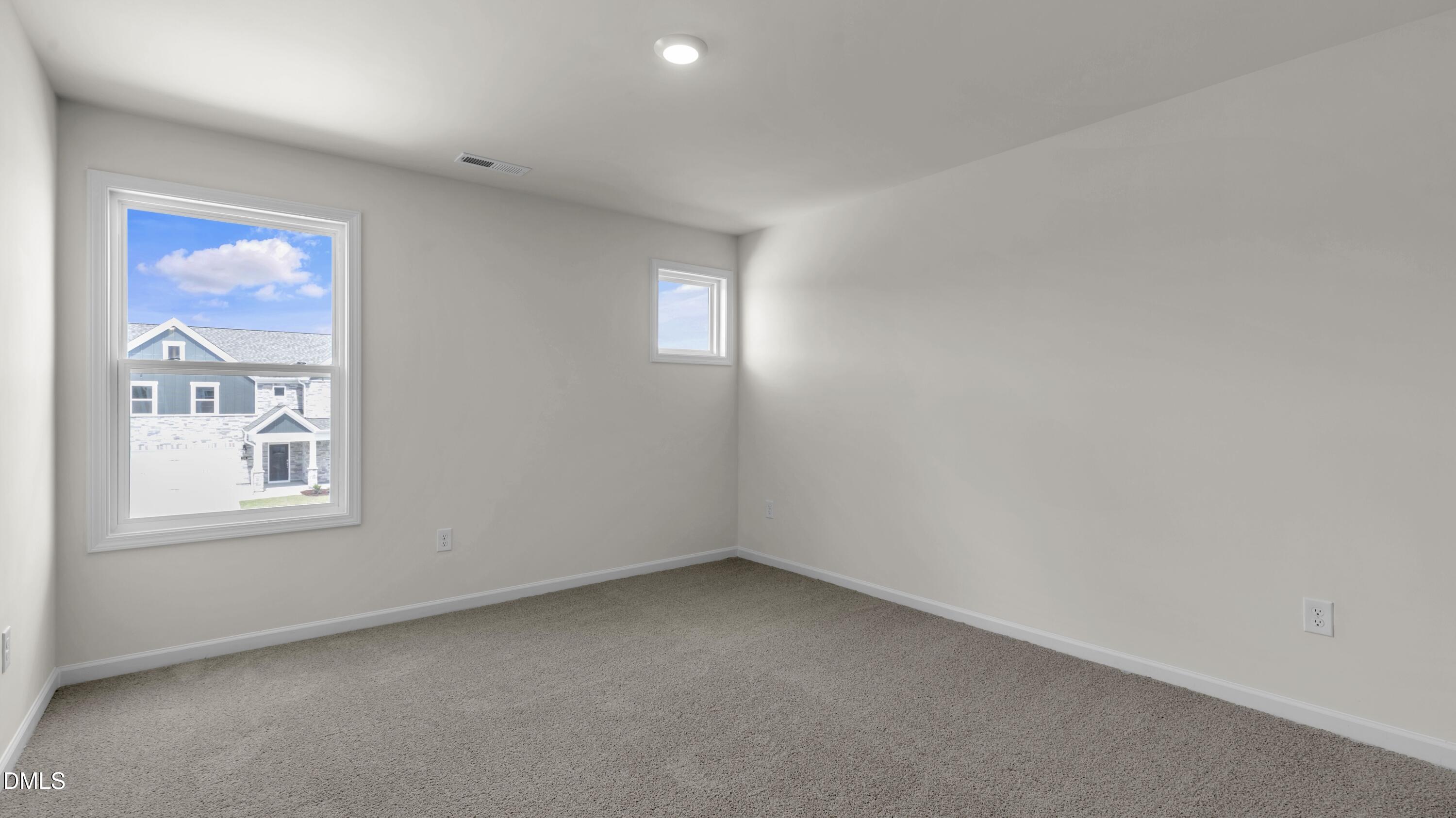 191 Gilmer Street Fuquay-Varina, NC 27526 - Photo 24 of 40 an empty room with windows