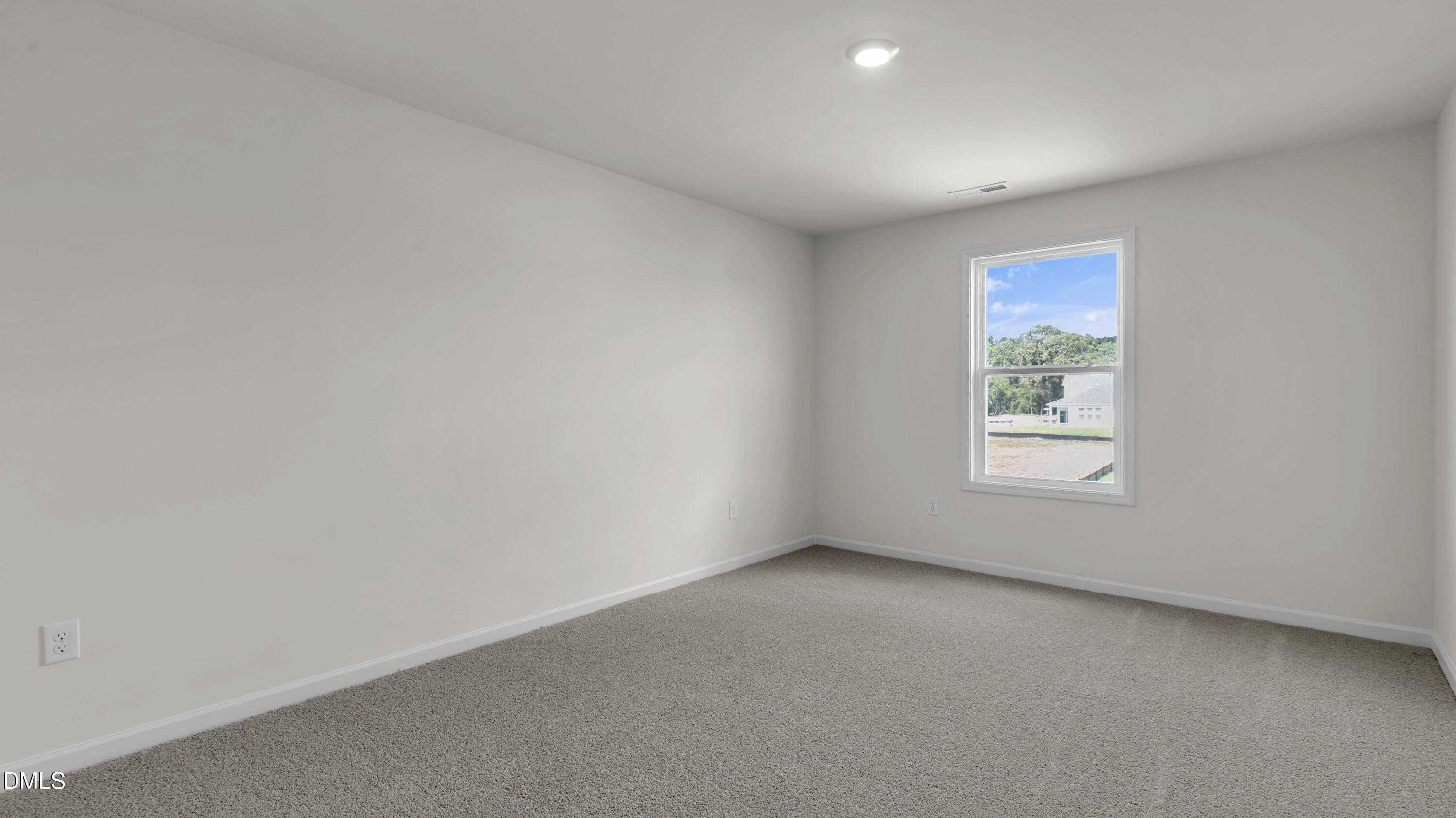 191 Gilmer Street Fuquay-Varina, NC 27526 - Photo 26 of 40 a view of an empty room with a window