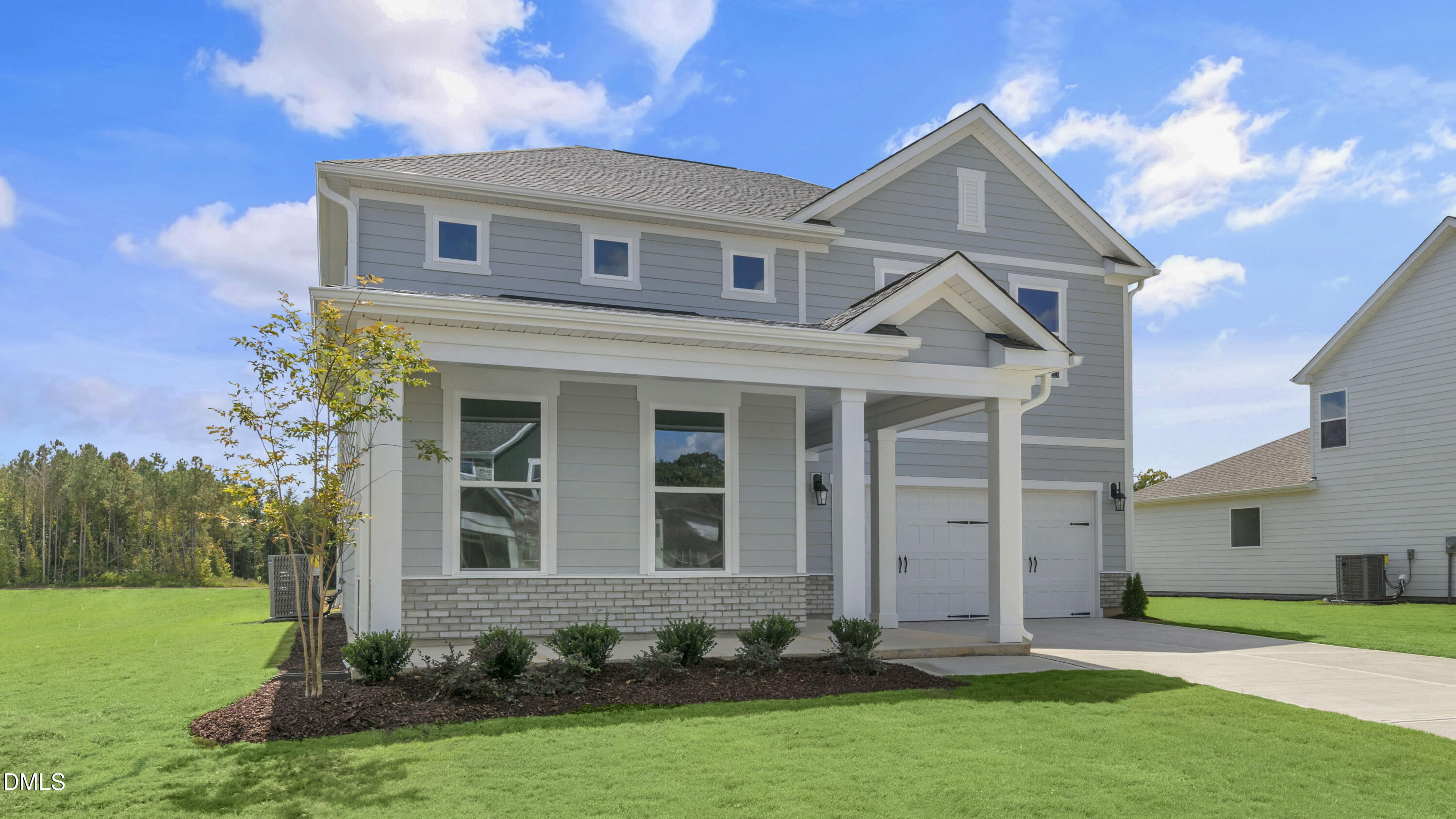 191 Gilmer Street Fuquay-Varina, NC 27526 - Photo 3 of 40 front view of a house with a yard