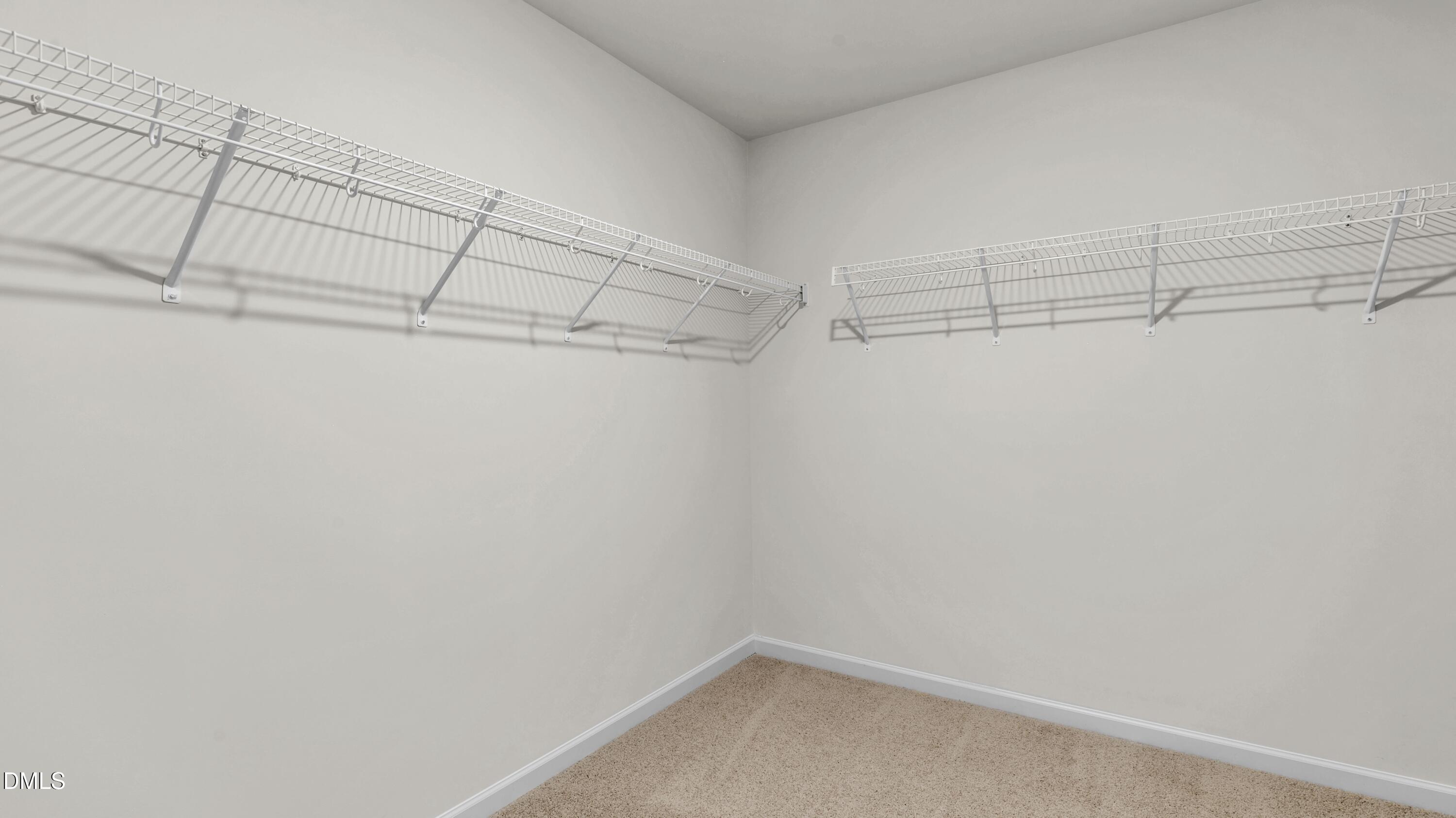 191 Gilmer Street Fuquay-Varina, NC 27526 - Photo 31 of 40 a view of a room with racks on the wall