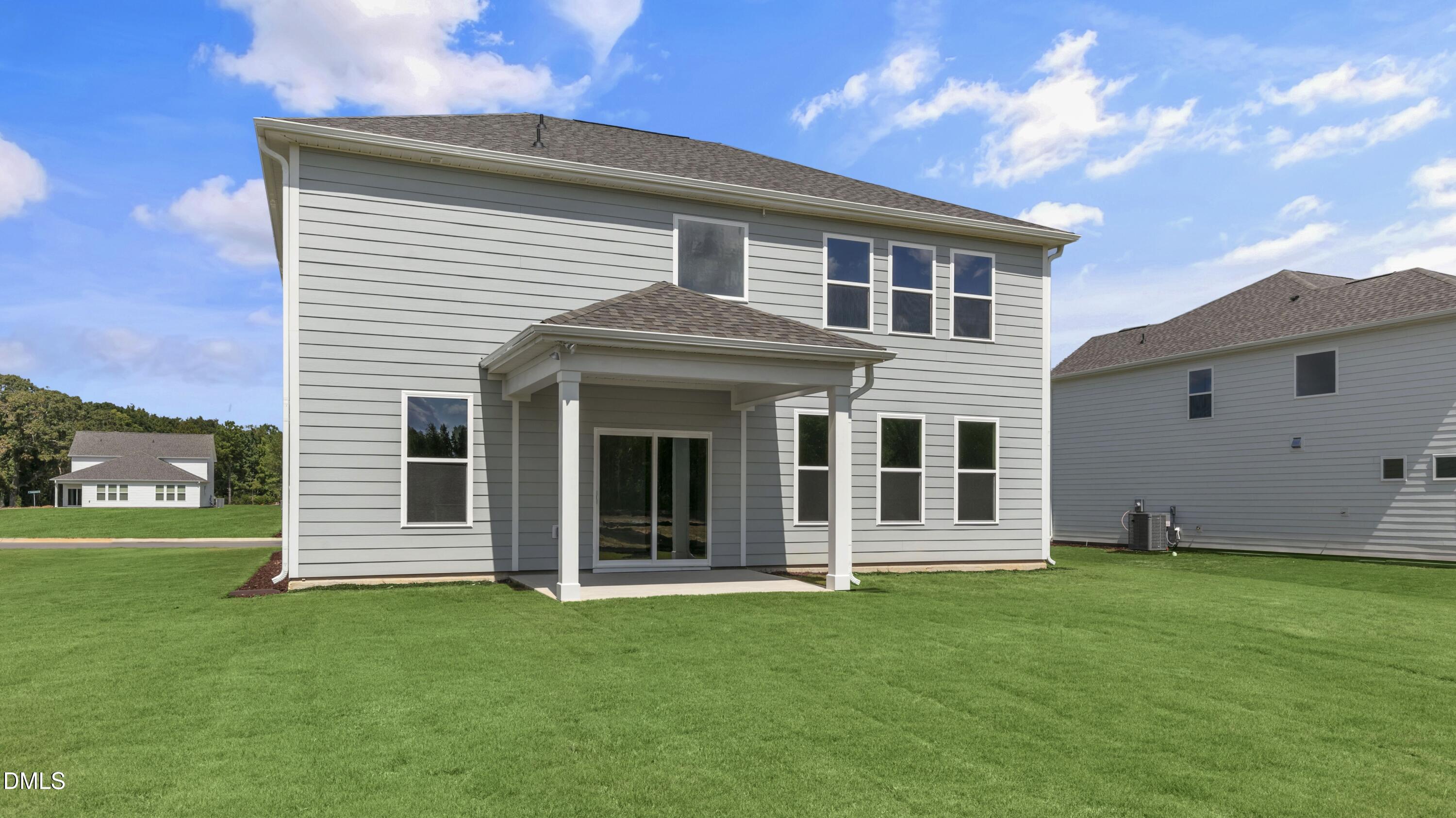 191 Gilmer Street Fuquay-Varina, NC 27526 - Photo 34 of 40 a view of a house with a backyard