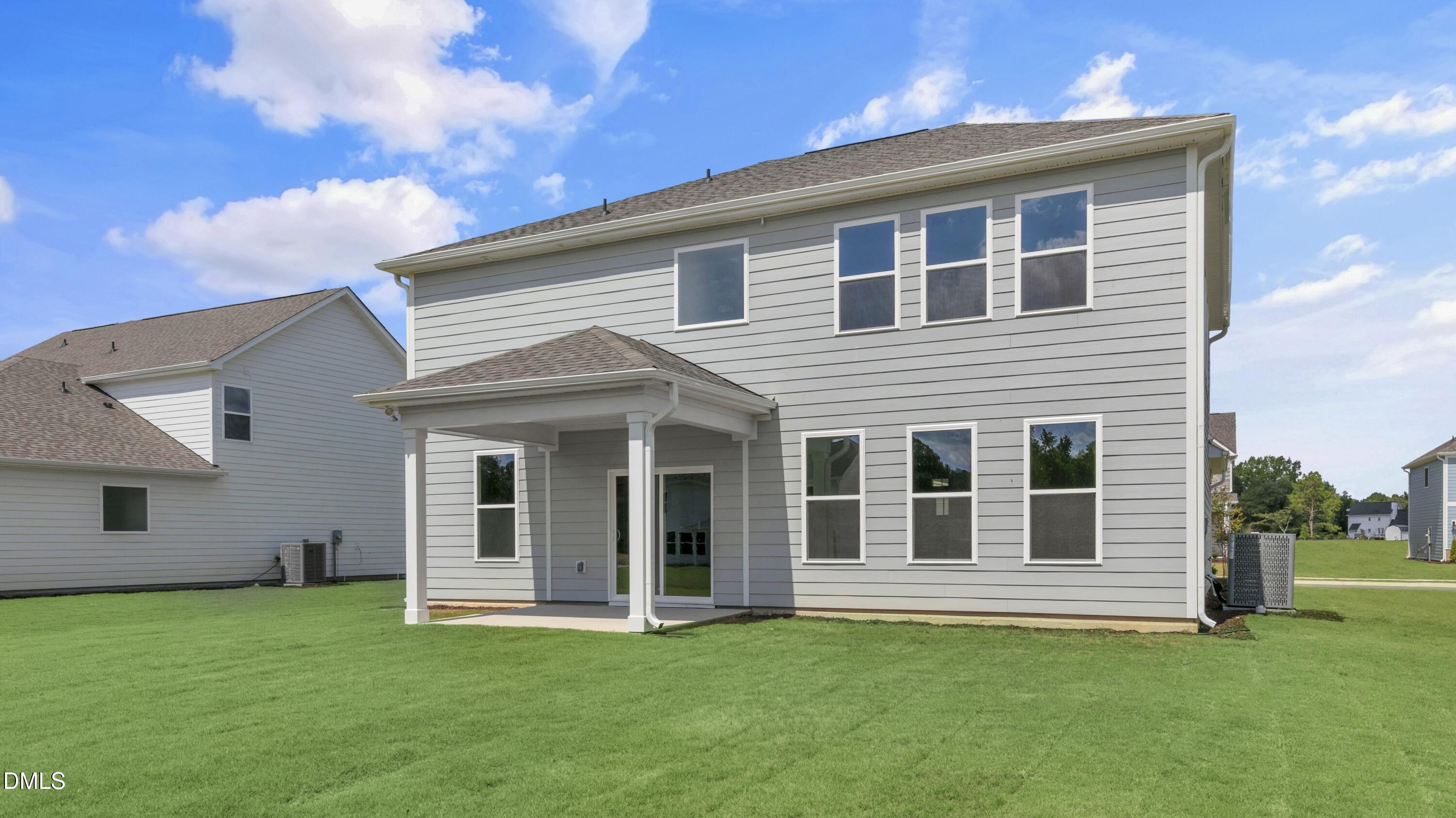 191 Gilmer Street Fuquay-Varina, NC 27526 - Photo 35 of 40 a house that has a big yard in front of it