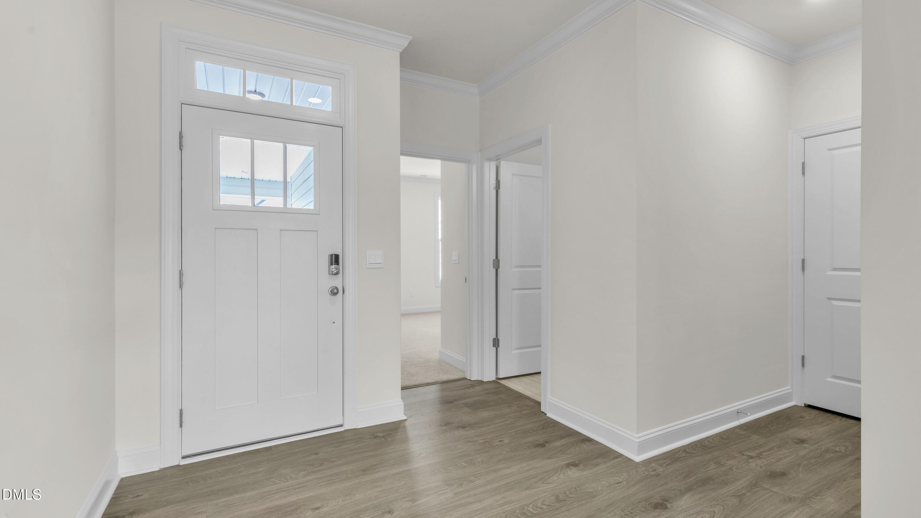 191 Gilmer Street Fuquay-Varina, NC 27526 - Photo 6 of 40 an empty room with wooden floor