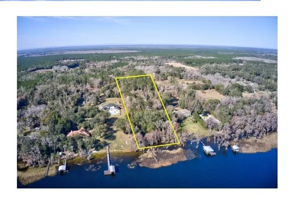 an aerial view of a house with a mountain view
