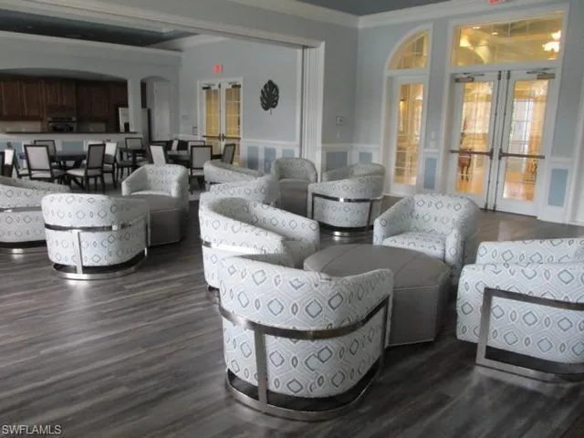 a view of a house with pool and chairs